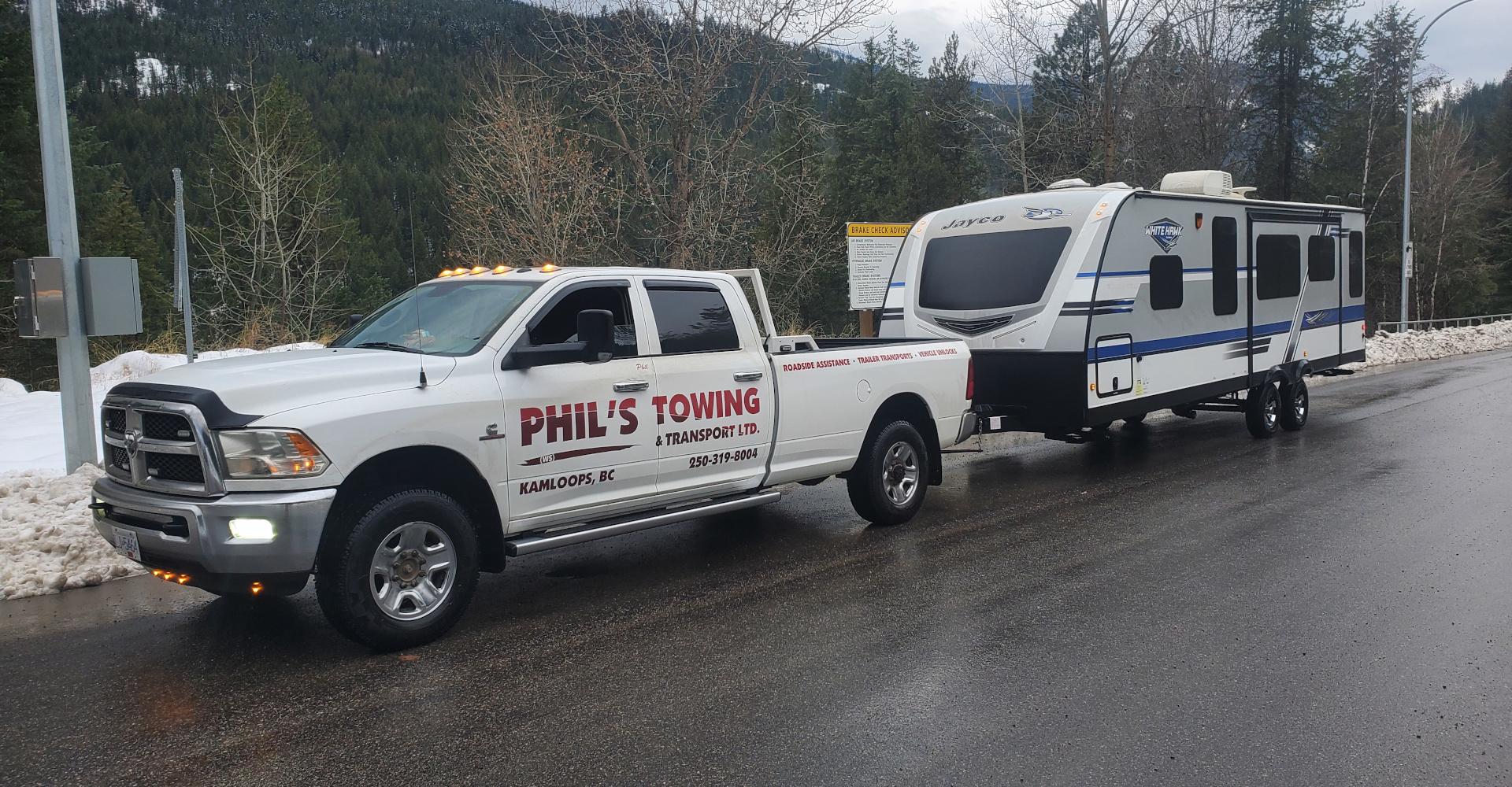 Phils ws Towing truck pulling a small RV Trailer in BC