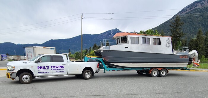 Tow truck pulling a boat