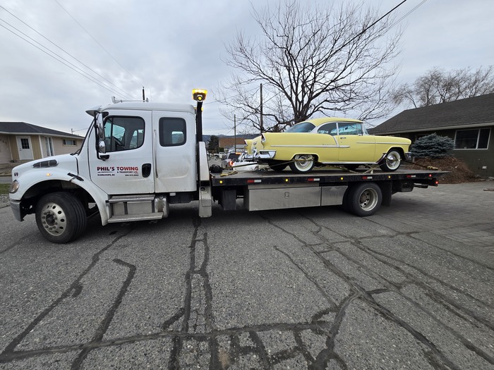 Towing a yellow classic car in Kamloops with Phil's Towing